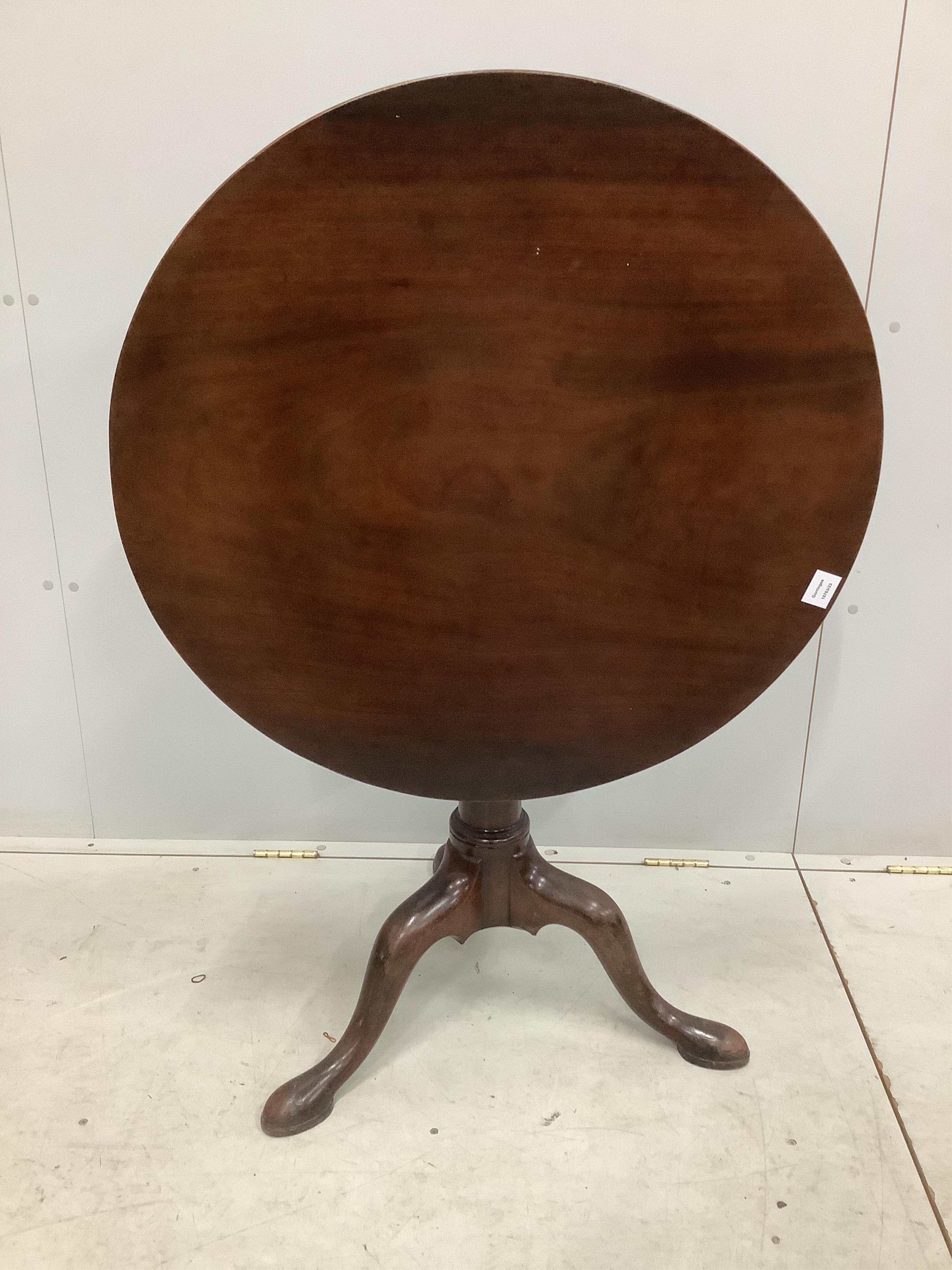 A George III circular mahogany tilt top tea table, diameter 81cm, height 71cm. Condition - fair to good